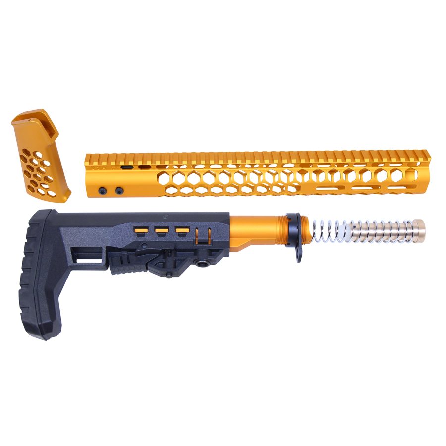 Gold anodized AR rifle parts showcase: stock, buffer tube, handguard, and pistol grip.