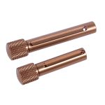 Polished copper components with knurled ends, showcasing precision machining for industrial applications.