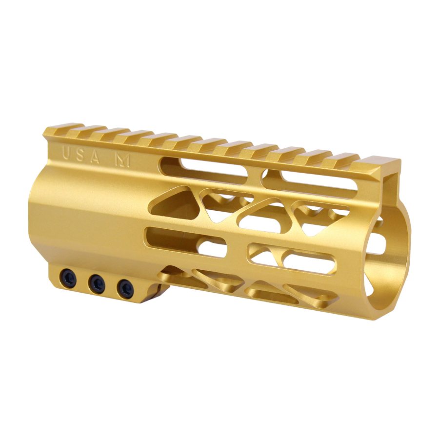 Gold anodized firearm handguard with geometric cutouts and Picatinny rail, engraved USA M.