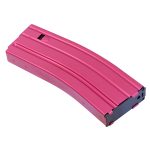 Pink AR-15 magazine with metallic finish, black base, and horizontal ridges against white background.