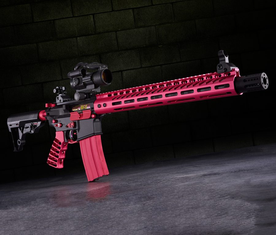 Red and Black Custom Tactical Rifle with Optics on Reflective Surface.
