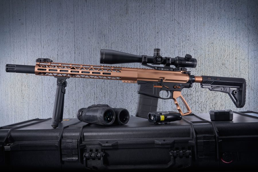 High-end tactical rifle with Vortex scope, bronze handguard, Crimson Trace binoculars, for precision shooting.