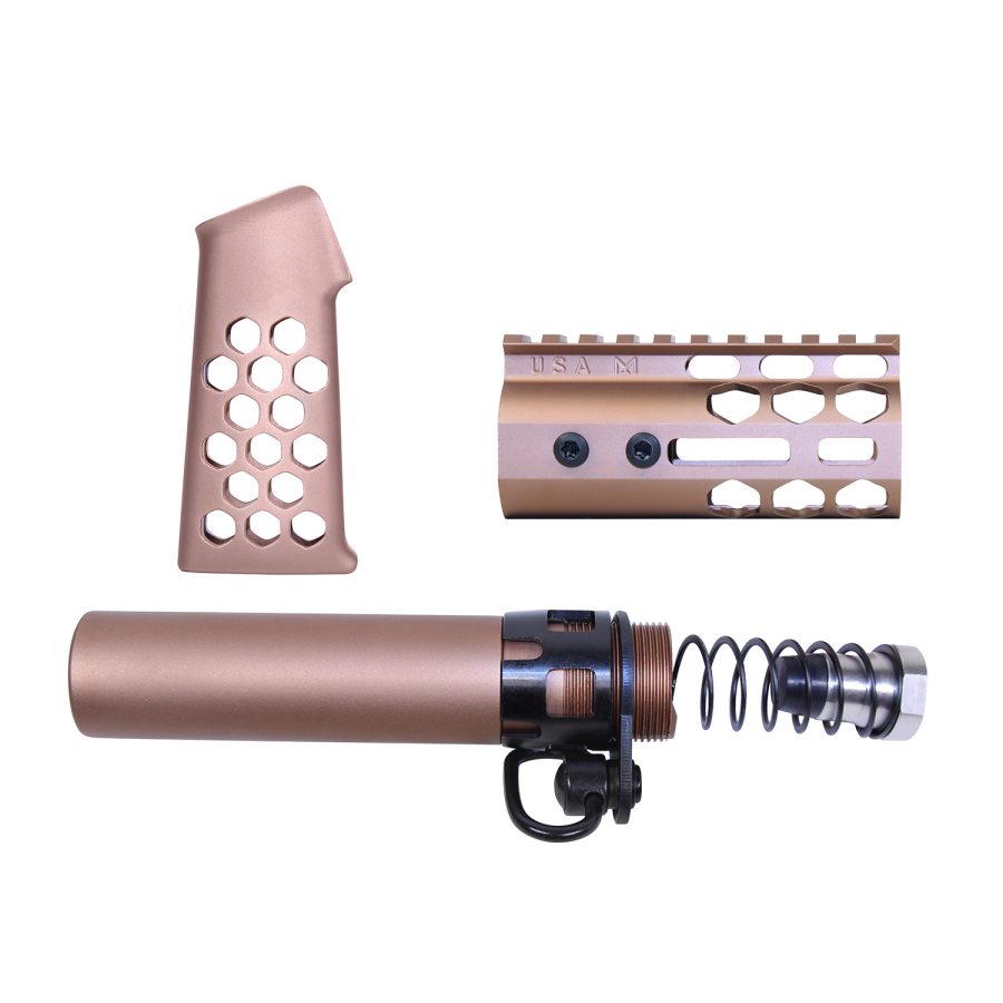Rose gold firearm kit with grip, handguard, and buffer tube for customization.