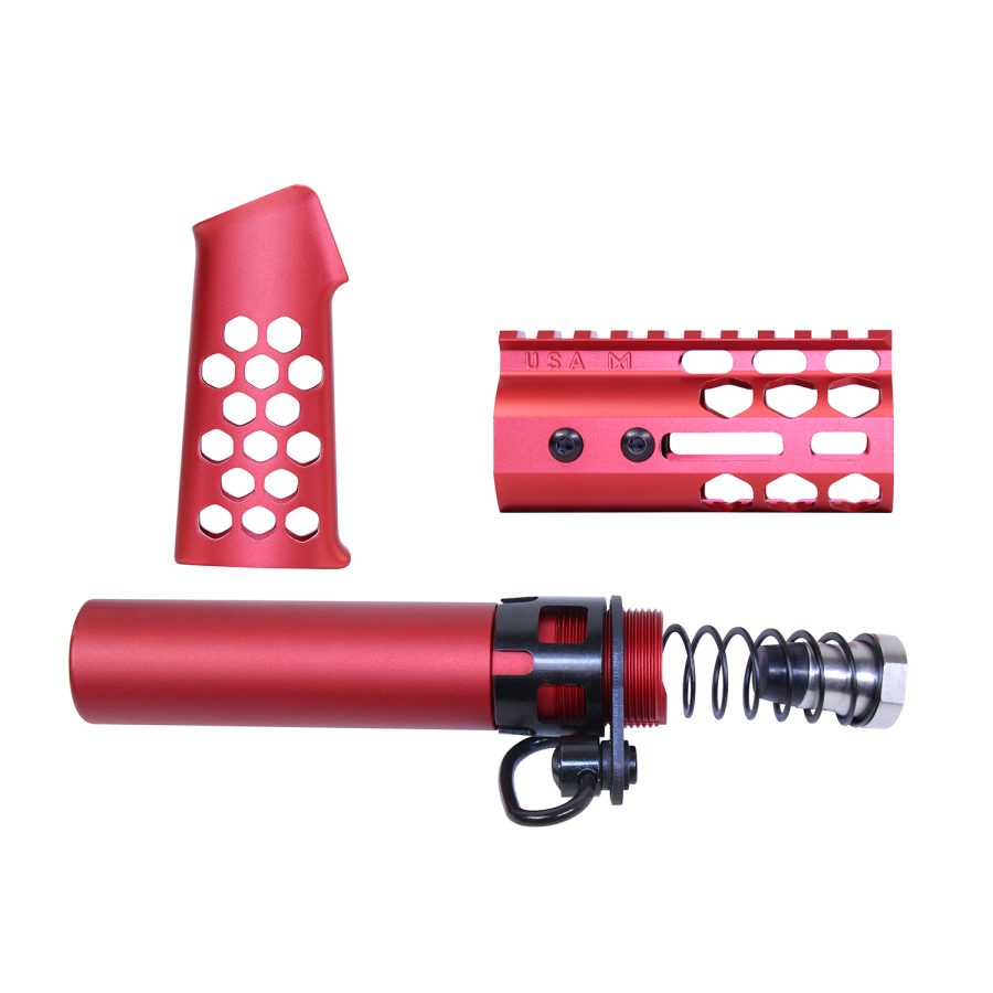 Red anodized firearm parts: pistol grip, handguard, buffer tube against white background.