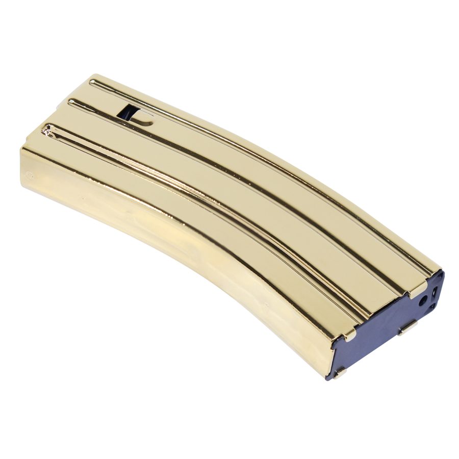 Gold-plated AR-15 magazine: polished collectible with distinctive ribbed texture on white background.