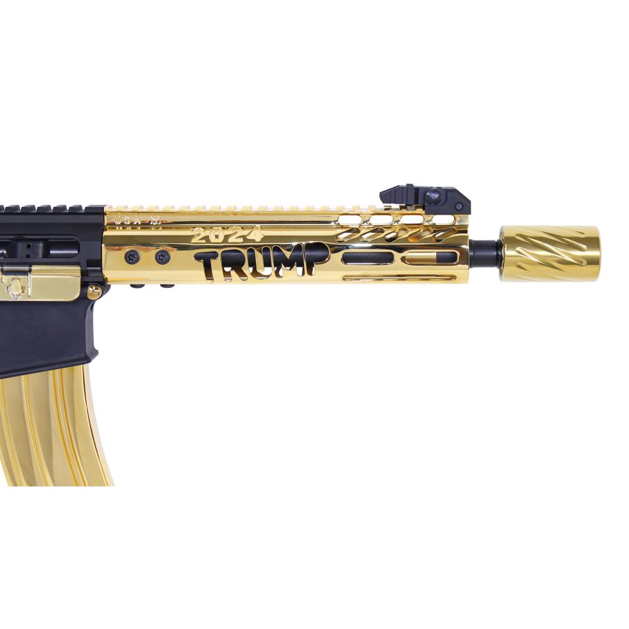 Customized gold-plated firearm featuring Trump engraving, highlighting its political and decorative significance.