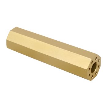 Gold hexagonal brass component with circular opening, machined for precision and upscale applications.