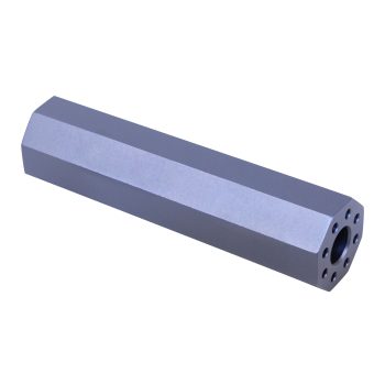 Precision-machined aluminum component with hexagonal design; drilled holes for mechanical assembly.