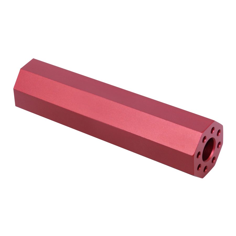 Red anodized metal component with hexagonal shape and symmetrical holes, precision-crafted for technical use.