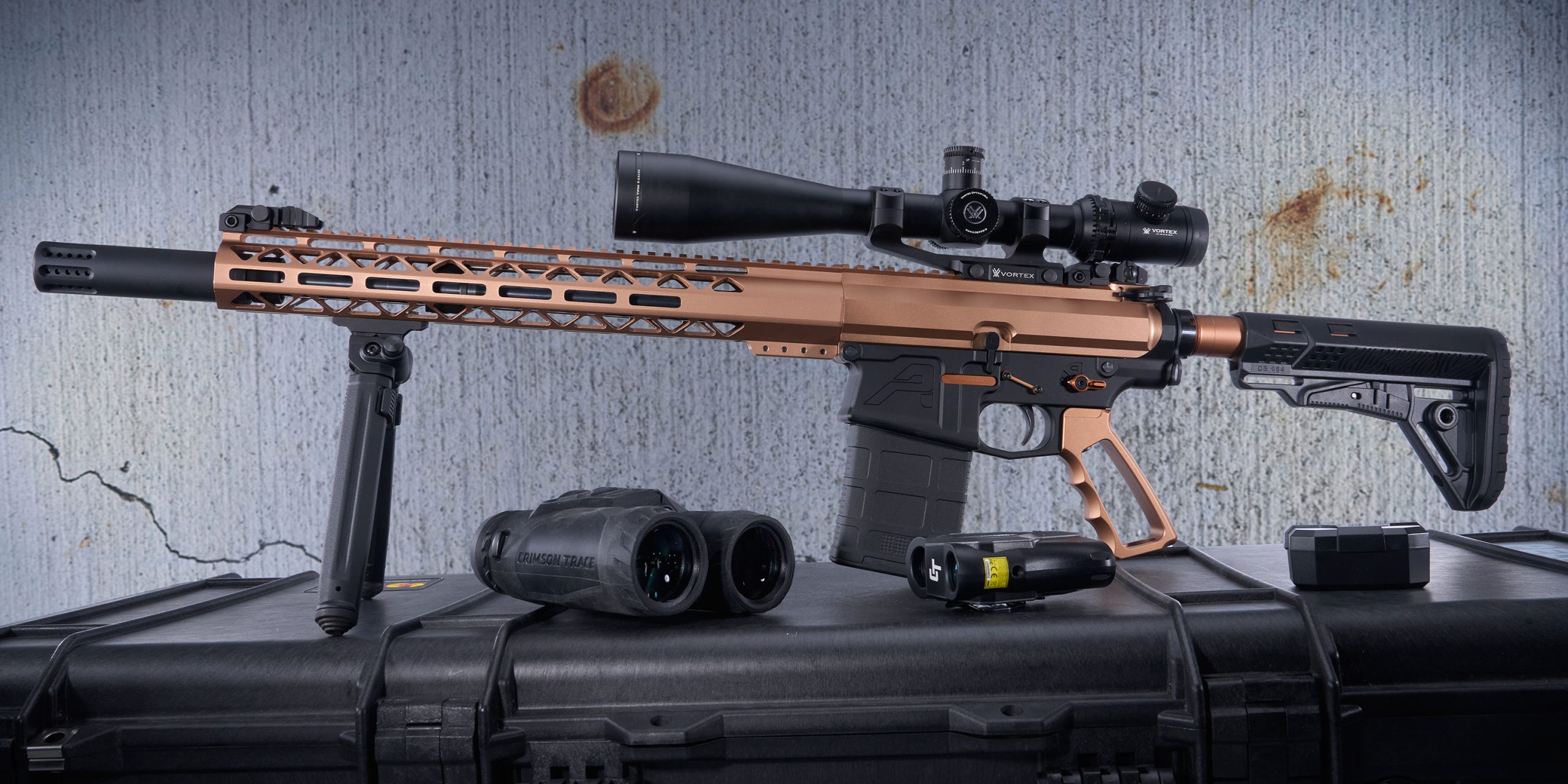 High-end copper precision rifle with Vortex scope, tactical gear, and accessories for long-range shooting.