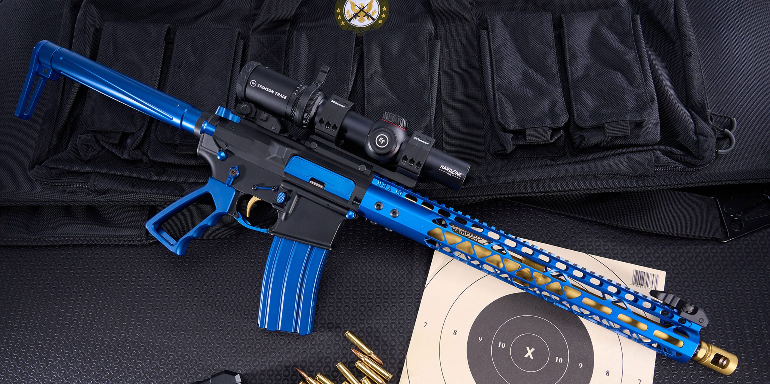 Custom blue and black assault rifle with tactical accessories and target display.