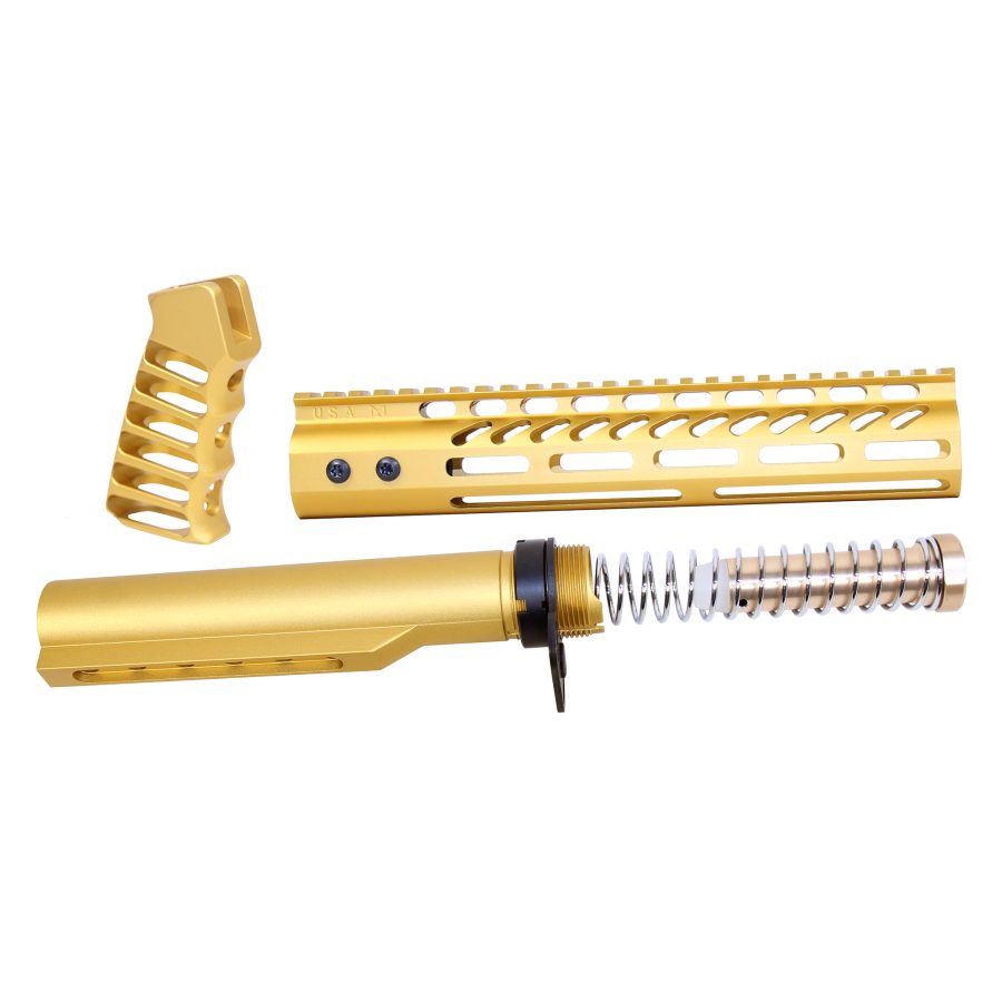 Gold-anodized AR-15 accessories: handguard, buffer tube with spring, ergonomic pistol grip on display.