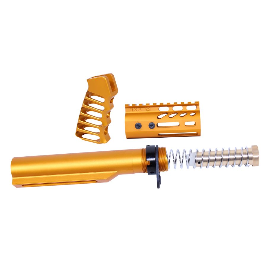 Gold anodized rifle accessories: buffer tube, pistol grip, handguard for custom firearms.