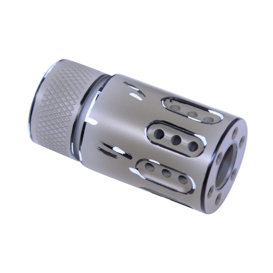 Silver muzzle device with diamond grip, oval ports, precision-engineered for recoil reduction.